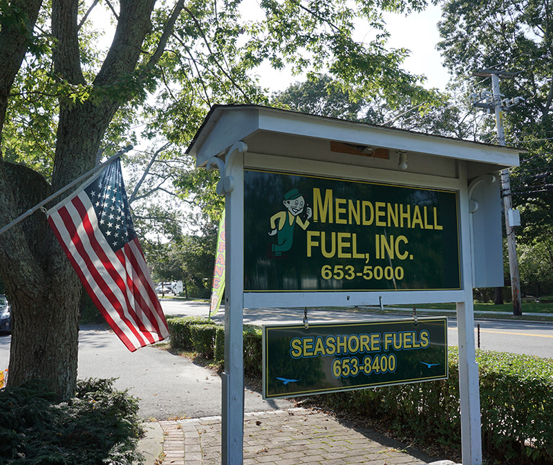 Mendenhall Fuel outdoor sign and American Flag